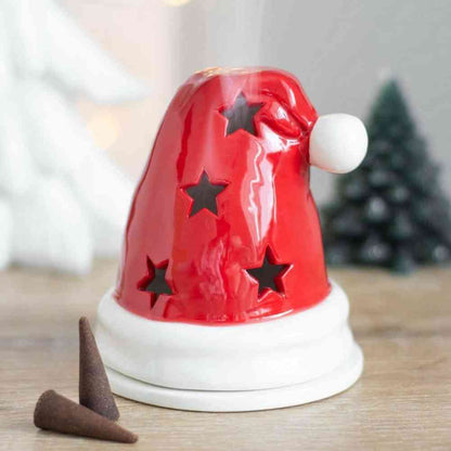 Santa hat incense burner, red ceramic with star cutouts, white brim and white pom-pom