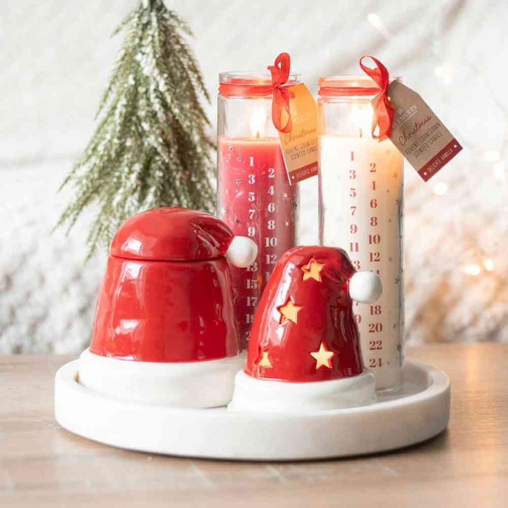 Santa hat incense cone burner with red hat and white base, star cutouts and tealight cups