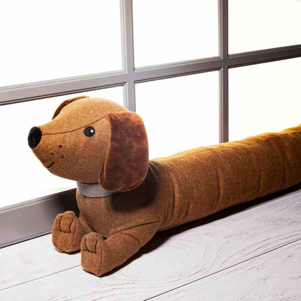 Dachshund draft excluder plush, front view with long body, floppy ears, and paws