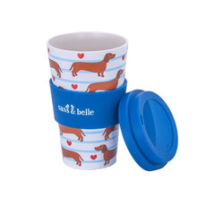 Travel coffee cup with dachshund pattern and blue lid, lid shown open
