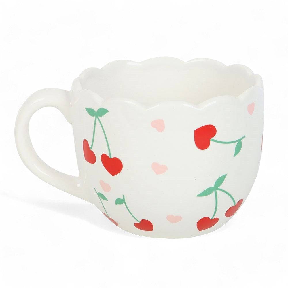 White scalloped mug with red and pink heart pattern and green cherry stems