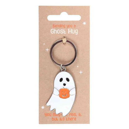 Ghost hug keyring with white ghost charm holding orange pumpkin-shaped heart on card