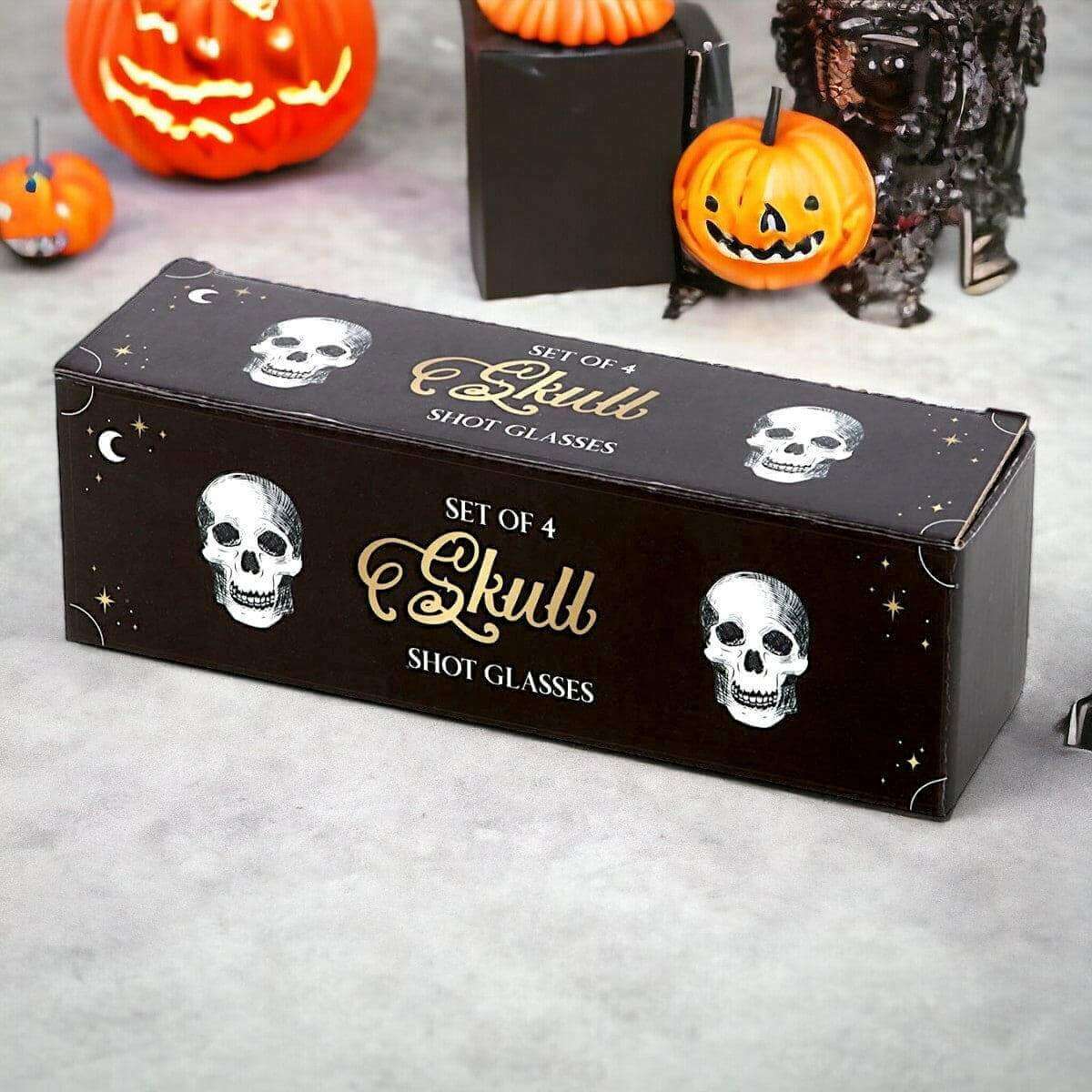 Set of 4 skull shot glasses gift box with skull graphics and moon-star accents