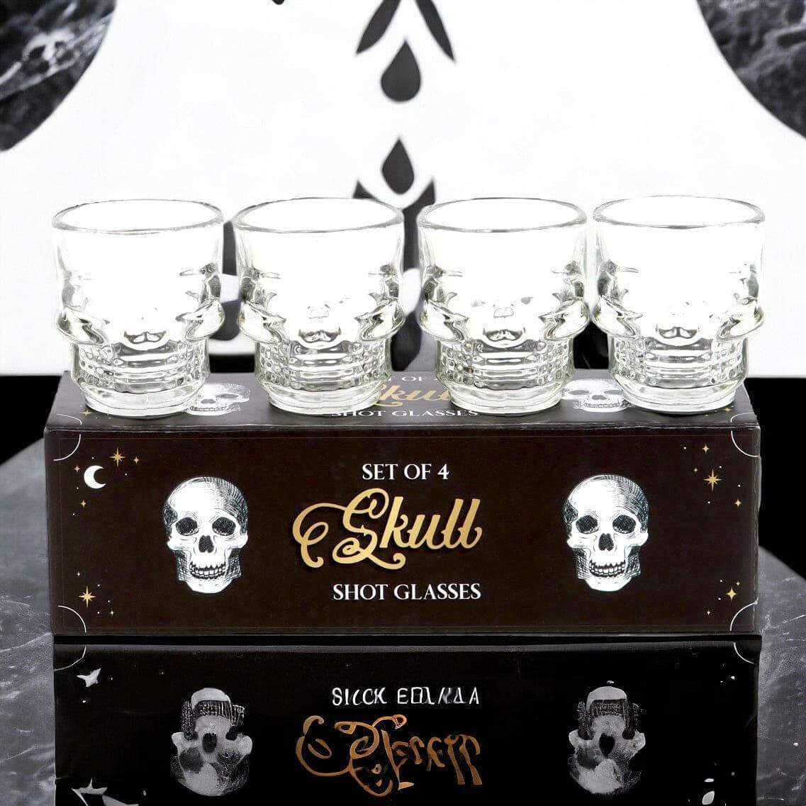 Set of 4 clear skull shot glasses on gift box, etched skull face designs