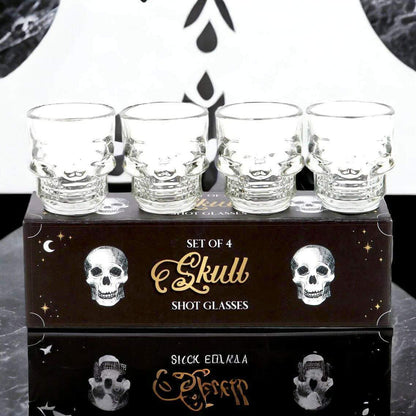 Set of 4 clear skull shot glasses on gift box, etched skull face designs