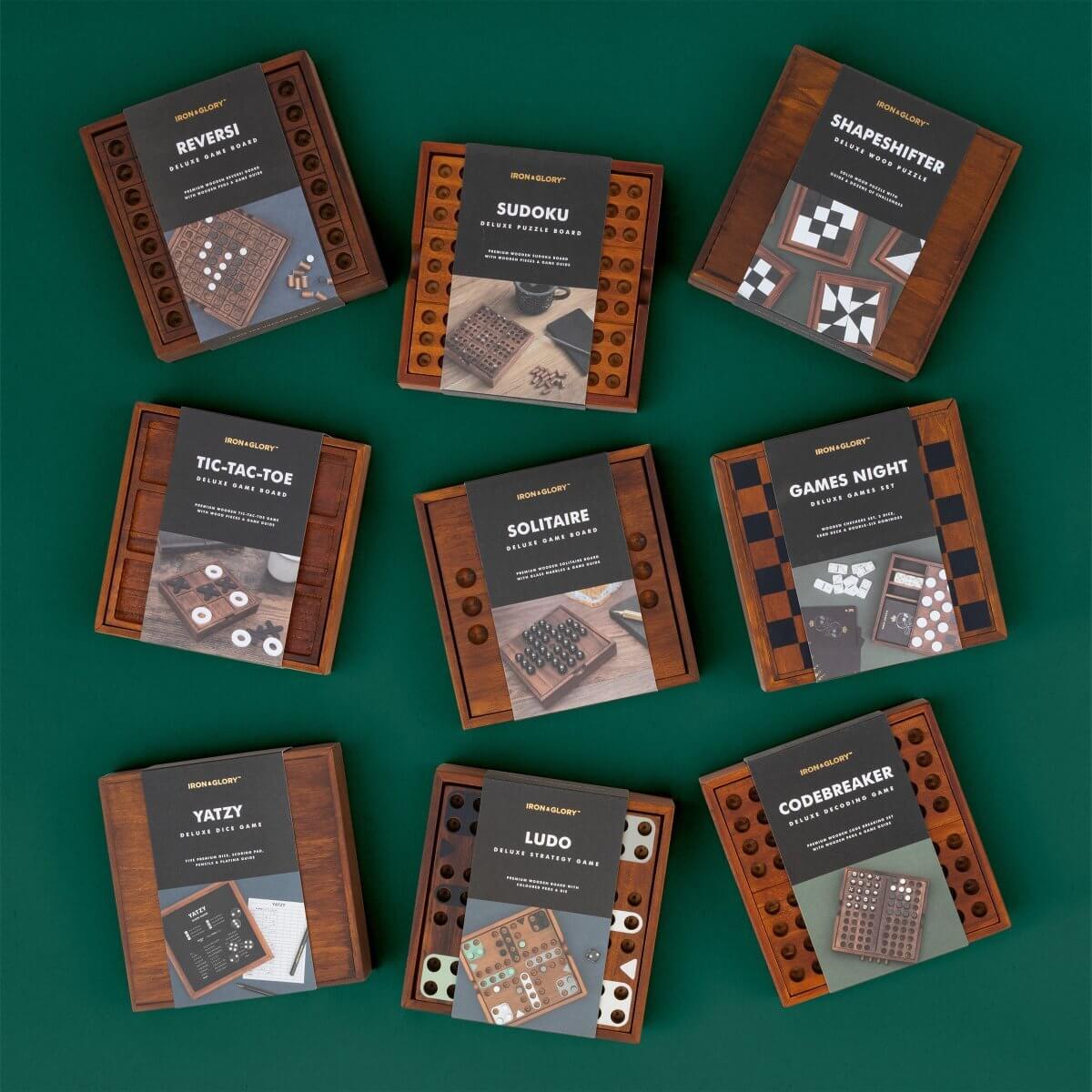Assorted wooden puzzle game boxes, including IRON&GLORY SHAPESHIFTER
