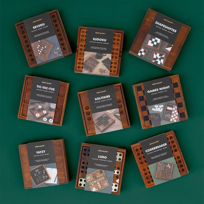 Assorted wooden puzzle game boxes, including IRON&GLORY SHAPESHIFTER