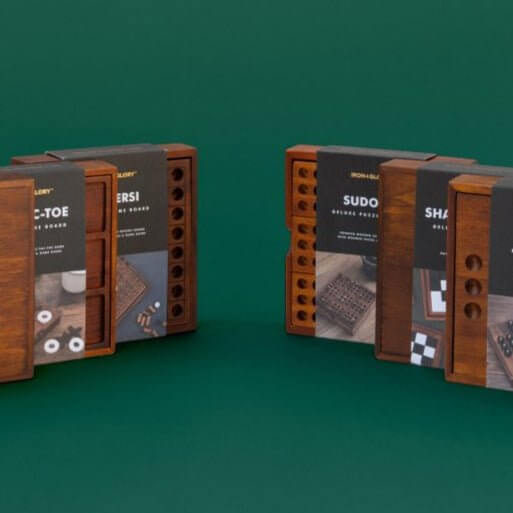 Wooden tangram challenge puzzle set in rectangular storage boxes with geometric pieces