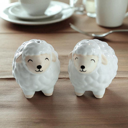 Sheep-shaped ceramic condiment shakers, gray and cream sheep figures with facial details