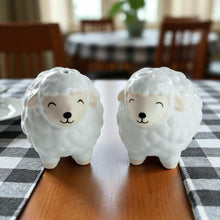 Sheep salt and pepper shaker pair, one gray and one cream sheep figurine with cute face