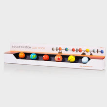 Solar system coat rack with colorful wooden planet hooks on a metal bar