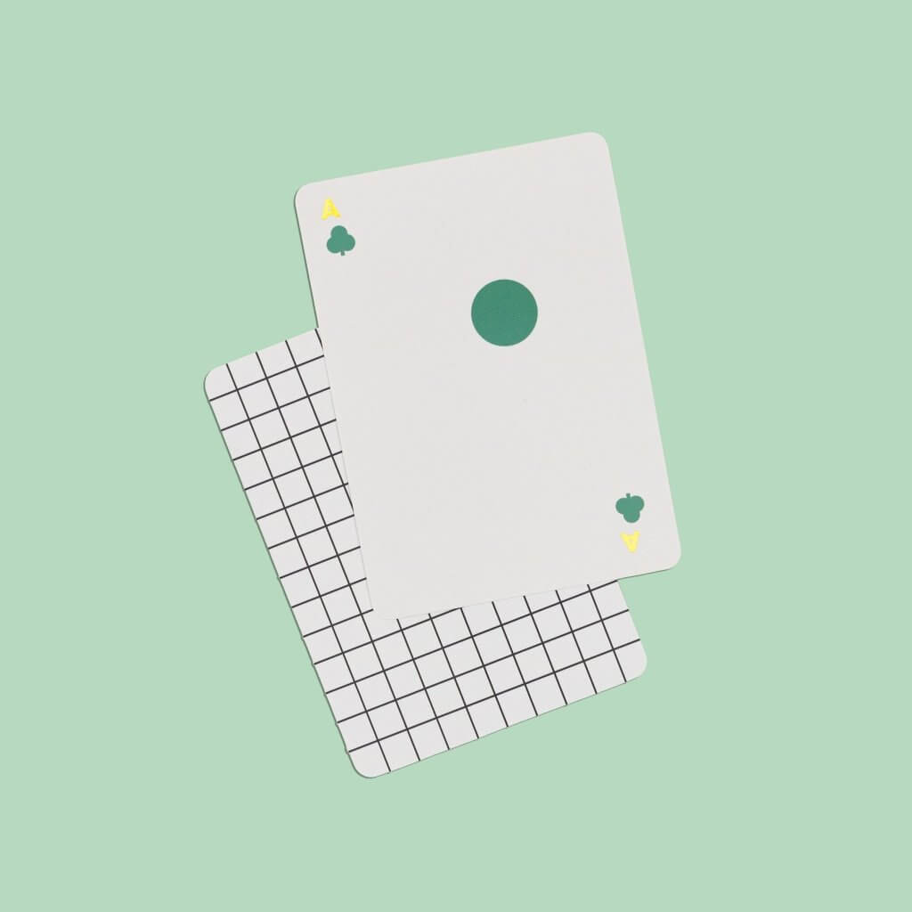 Solo Mello playing cards: single white card with a green circular suit mark