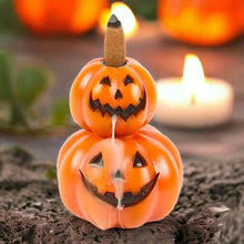 Stacked pumpkin jack-o-lantern backflow incense burner with two faces and incense stick