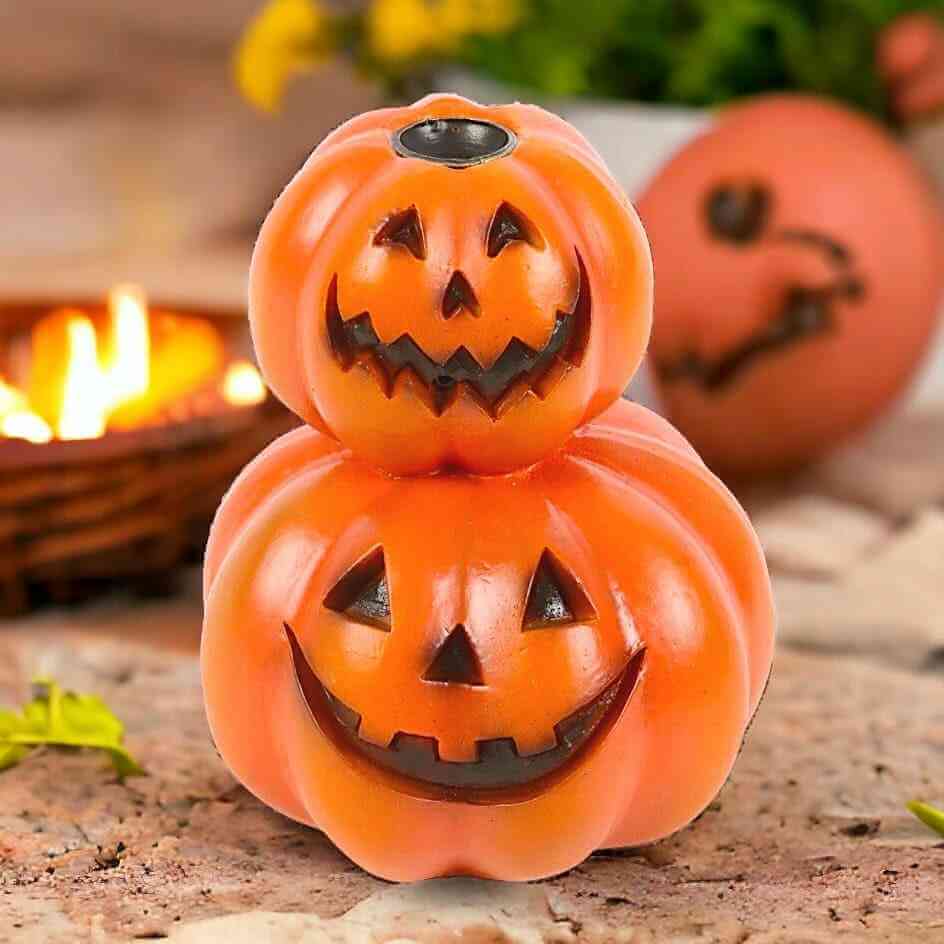 Stacked pumpkin jack-o-lantern backflow incense burner with two carved faces