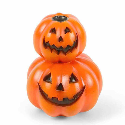 Stacked jack-o-lantern backflow incense burner with two carved pumpkins and incense stick