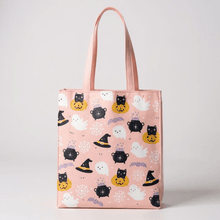 Pink poly-cotton tote with ghost, pumpkin, and cat faces print; fabric handles