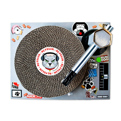 Turntable scratching toy with circular corrugated scratch surface and metal wand handle