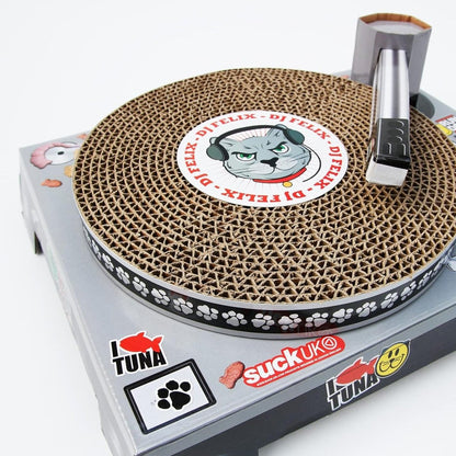 Close-up of round sisal scratching pad with cat graphic on turntable toy