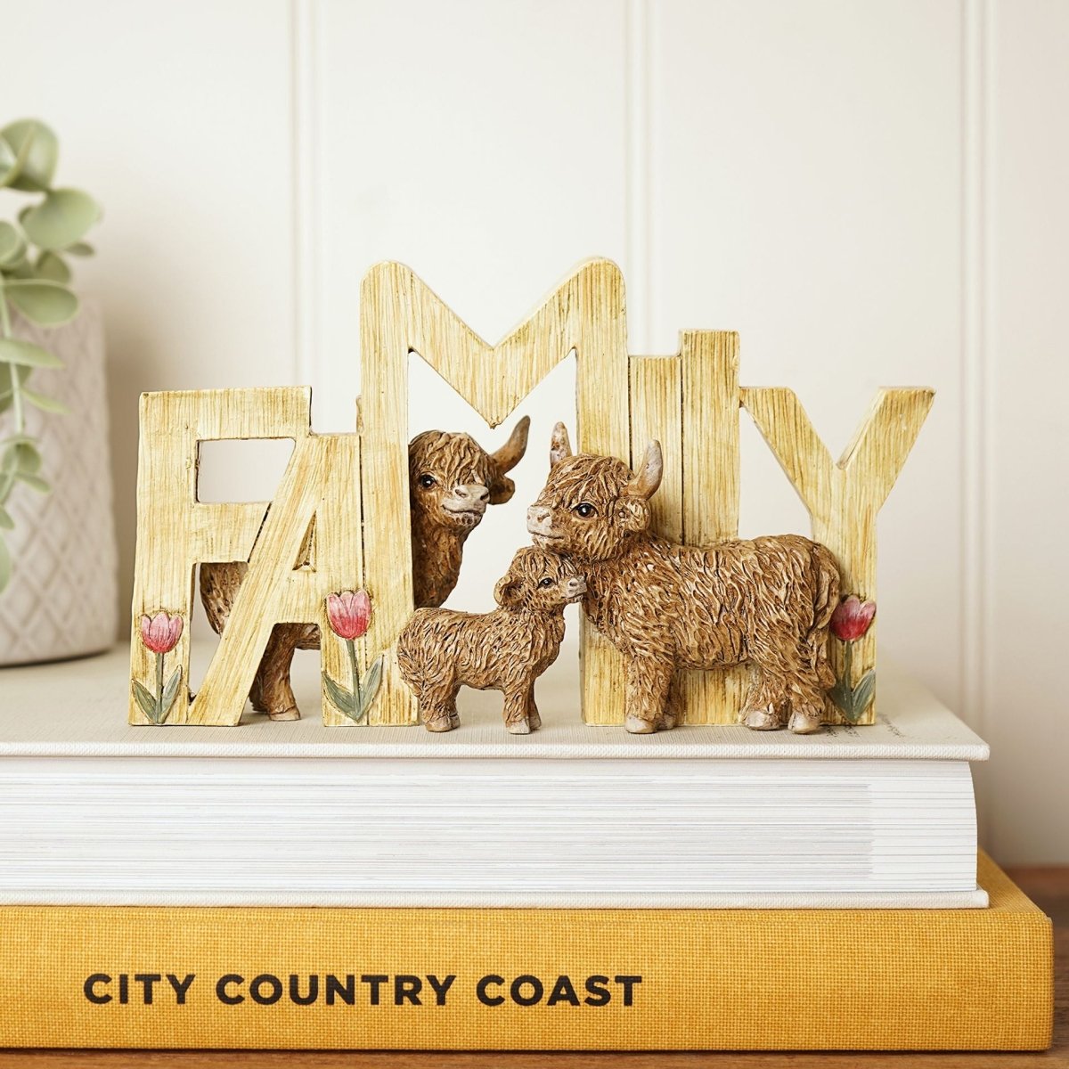 Wooden FAMILY plaque with three brown Highland cow figurines and pink tulip details
