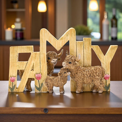Wooden FAMILY plaque with three brown Highland cow figurines and tulip accents on table