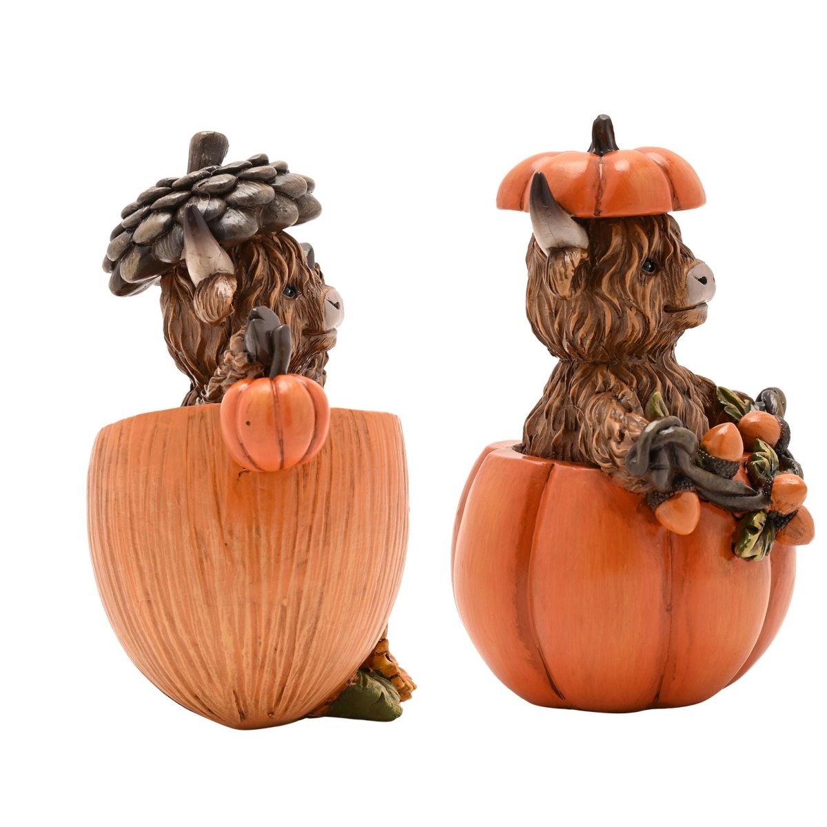 Decorative Highland cow figurines shown from the back in orange pumpkins and wooden planters