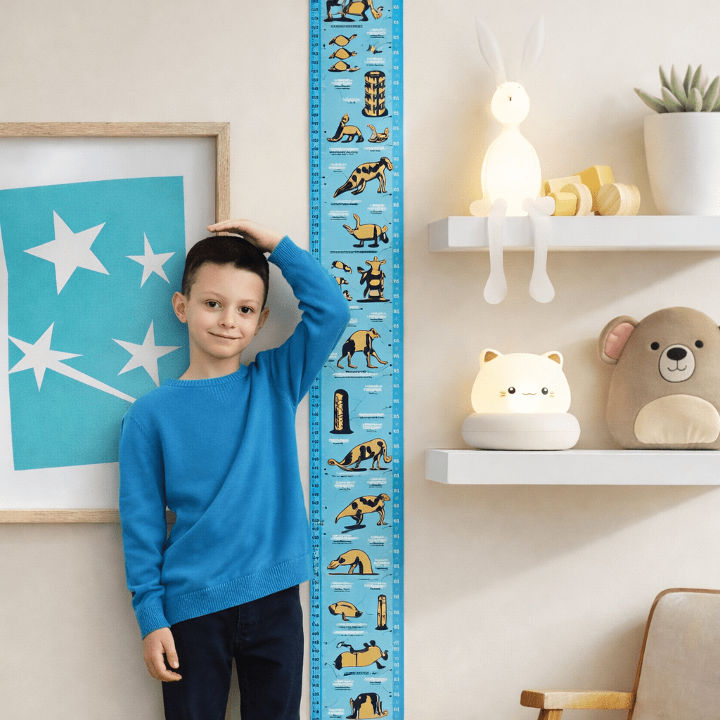 Kids height chart on wall, blue scale with animal icons beside a child