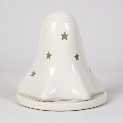White ceramic ghost tealight holder with star accents and hollow eye cutouts on base