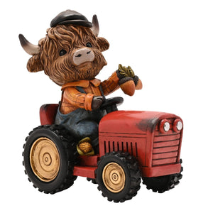 The Fashion Gift Shop: Highland Cow sits happily on a tractor, creating a charming rural scene by Country Living, Animal Ornament