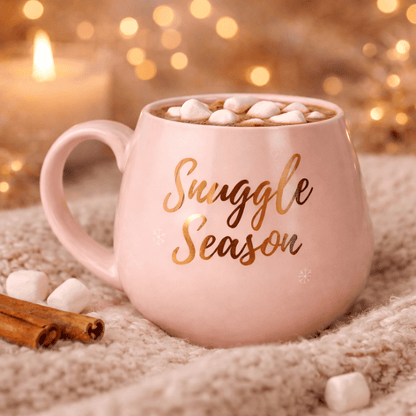 Pink ceramic mug with rose gold script lettering and marshmallows inside