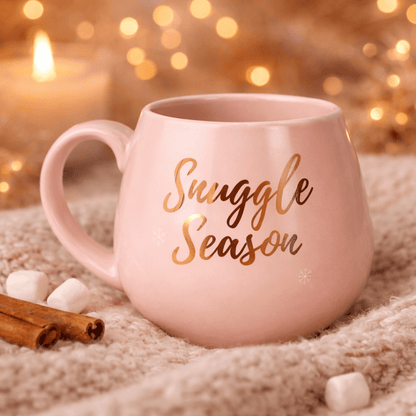 Pink ceramic mug with rose gold script lettering, empty interior