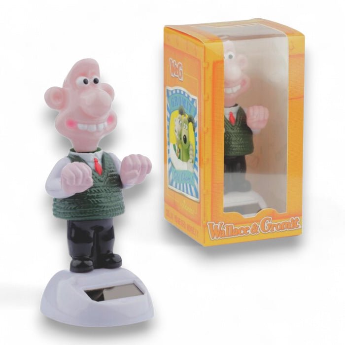 Solar-powered figurine in retail box, Wallace in green sweater and black boots