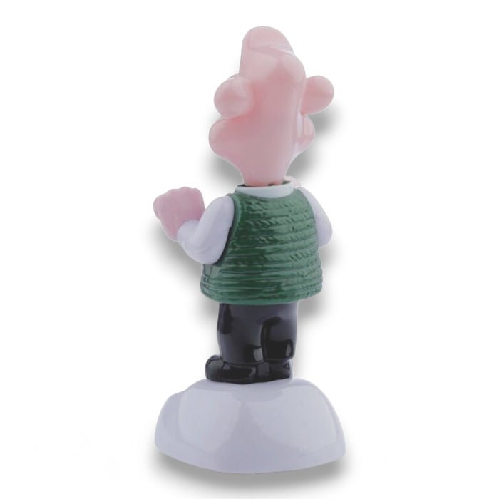 Solar-powered Wallace figurine back view with raised arms and green sweater