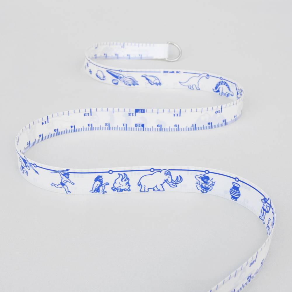 White measuring tape with blue dinosaur and vehicle graphics and metal loop end