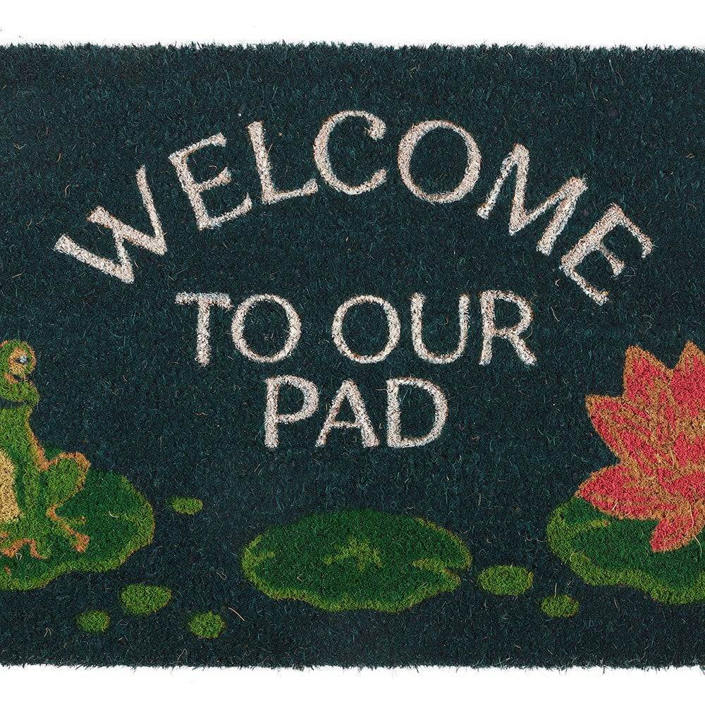 Close-up dark green doormat with Welcome to Our Pad text, frog, and red lily flower
