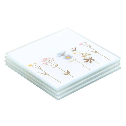 Set of four floral glass coasters, stacked white tiles with botanical wildflower print