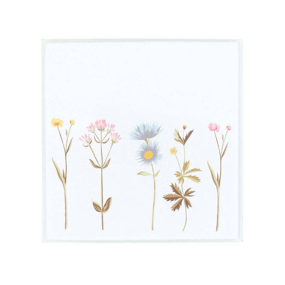 Floral glass coaster with botanical wildflower illustration in soft pastel tones