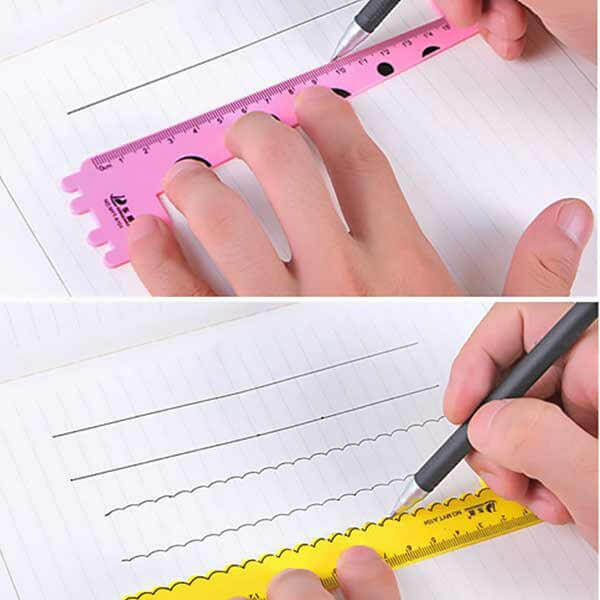 Pink animal-shaped kids ruler with raised giraffe/llama design and measurement marks