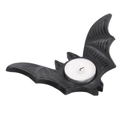 Bat-shaped tealight candle holder with white tealight candle and wick, black.