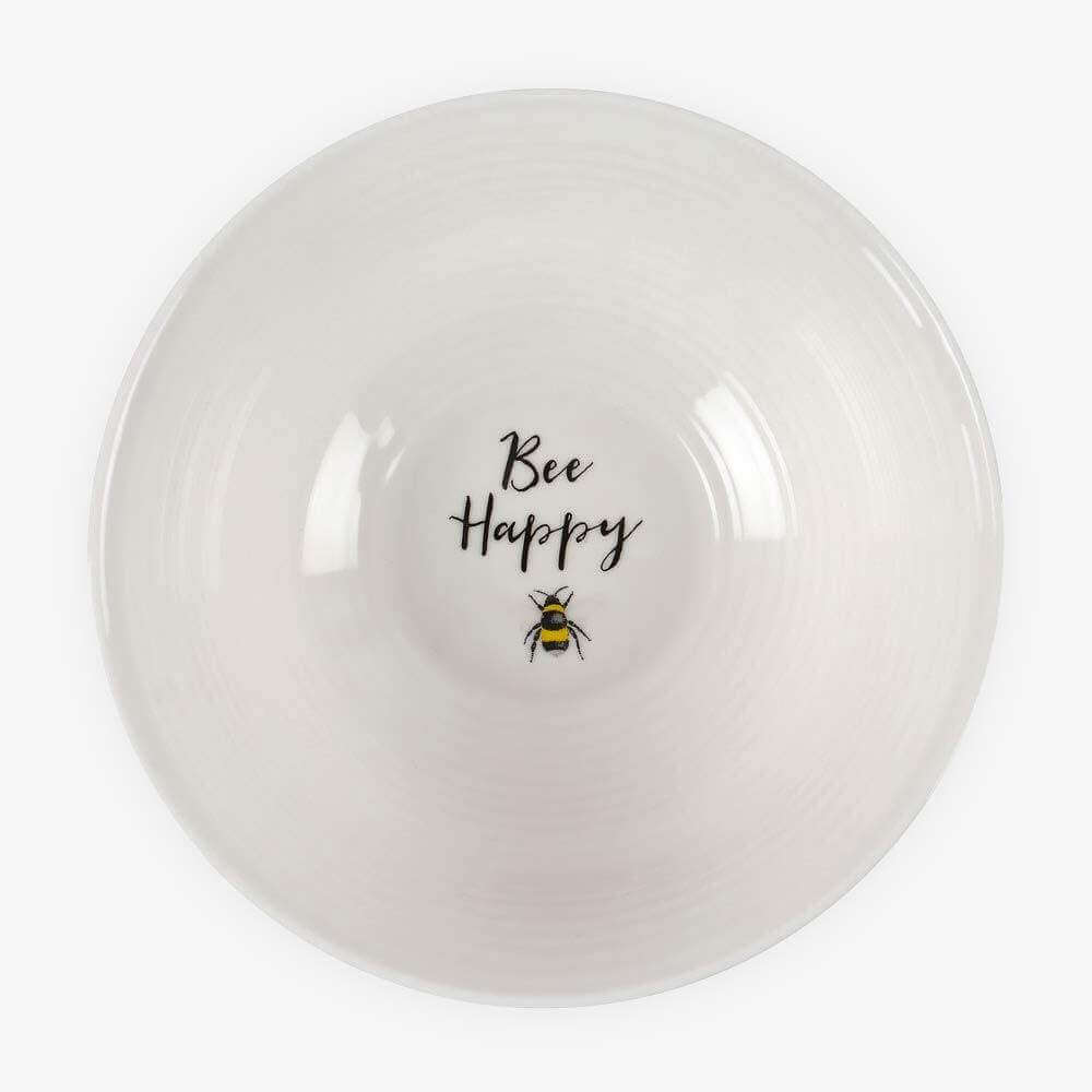 White ceramic breakfast bowl with glossy finish, “Bee Happy” text and bee graphic.