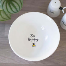 White ceramic breakfast bowl with “Bee Happy” text and small bee graphic in center.