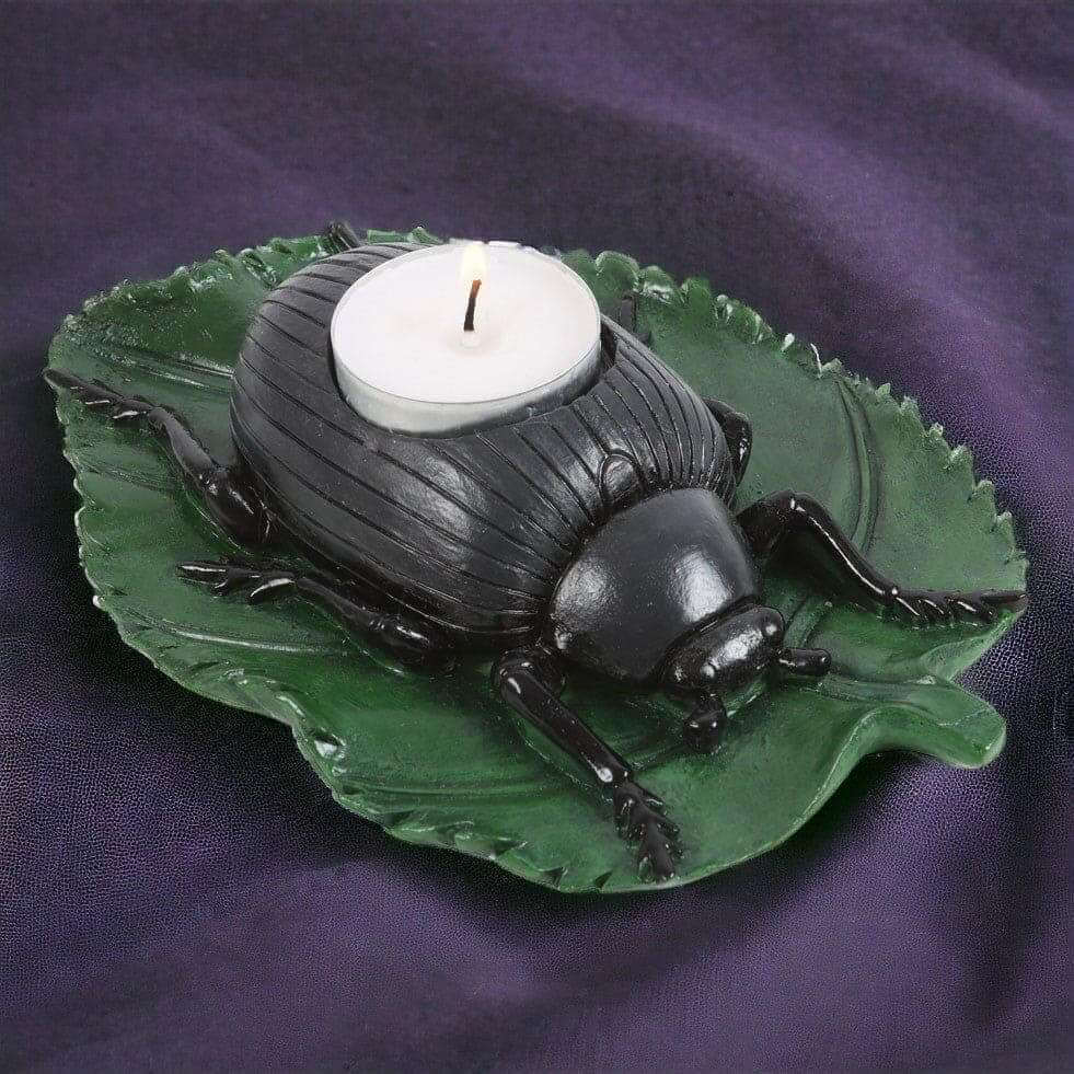 Beetle tealight candle holder featuring green leaf tray and black beetle with white tealight