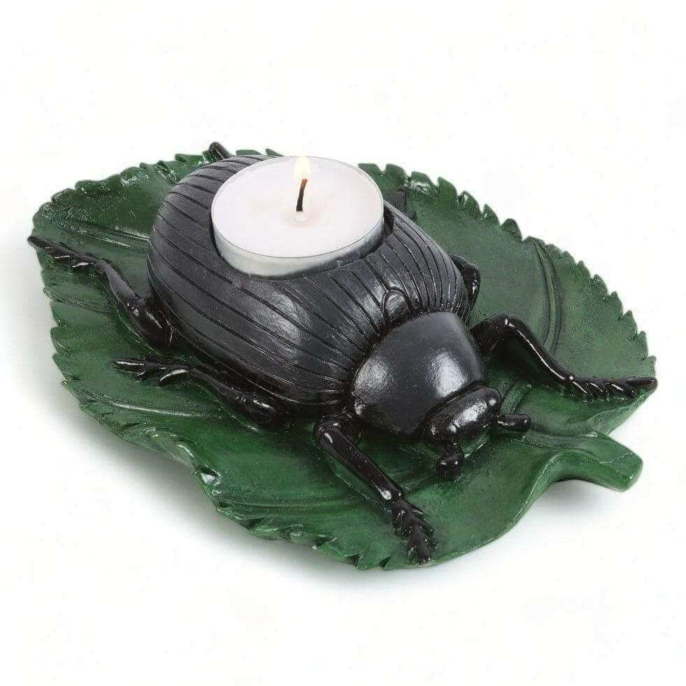 Beetle tealight candle holder with green leaf base, black beetle figurine, white tealight candle