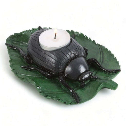 Beetle tealight candle holder with green leaf base, black beetle figurine, white tealight candle