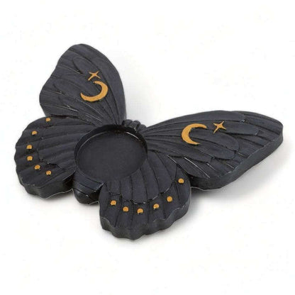 Moth tealight candle holder with layered dark wings, crescent moon and star accents, round candle opening