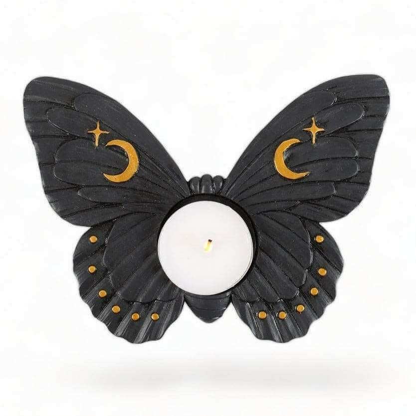 Moth tealight candle holder with dark wings, crescent moon and star accents, round candle cup