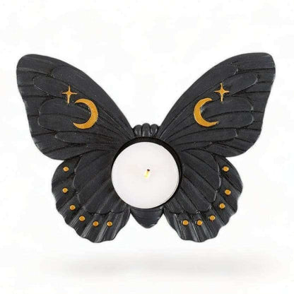 Moth tealight candle holder with dark wings, crescent moon and star accents, round candle cup