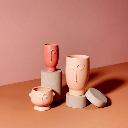 Set of matte face flower vases in blush pink with sculpted faces