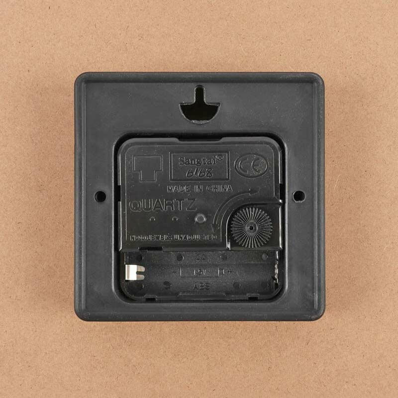 Quartz wall clock back plate with battery compartment and dark plastic housing