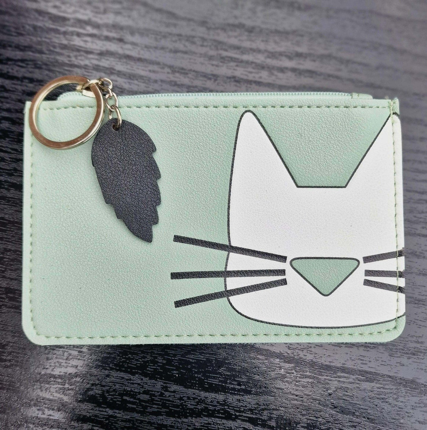 Mint green cat-face faux leather keyring purse with zipper and white cat graphic