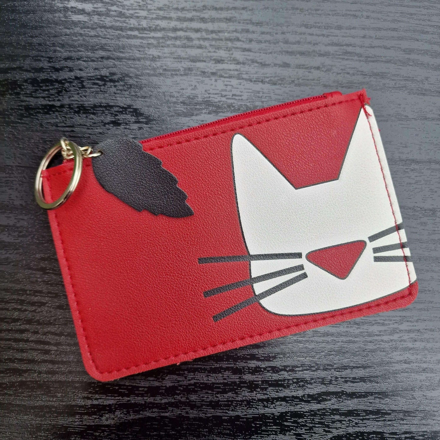 Red cat-face faux leather keyring purse with zipper and dark cat silhouette detail